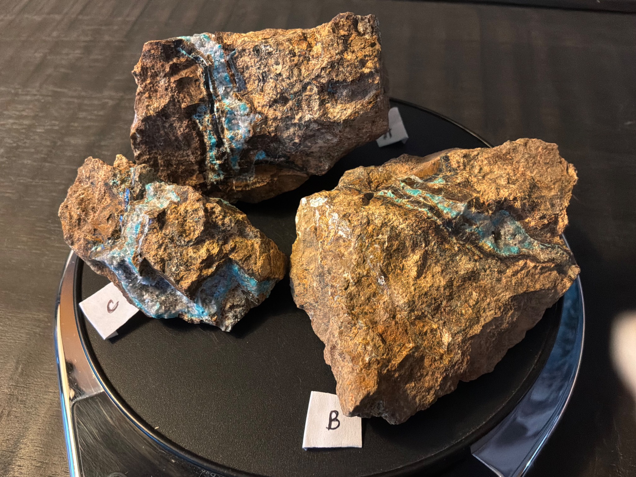 Three Leadville specimens with hemimorphite and vivid blue chrysocolla veins in brown jasperoid gossan